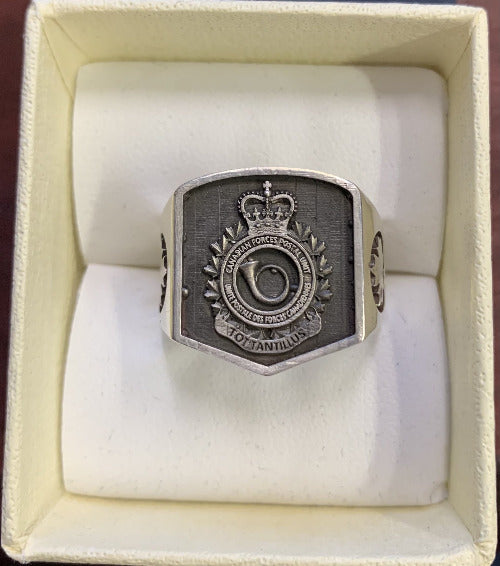 Square silver ring with the Royal Canadian Postal Corp Crst and maple leaf shoulders