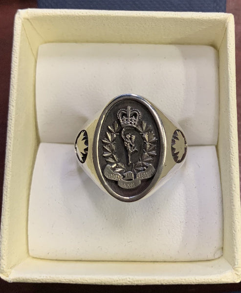 Silver ring with the First Canadian Signal Regiment Crest and maple leaf shoulders.