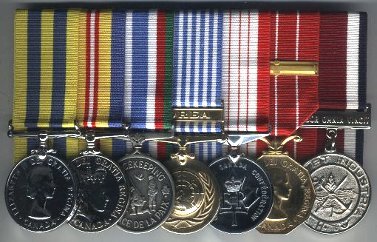 Rack of court mounted korean war and other medals.