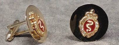 Gold cufflinks featuring the medical crest in colour.