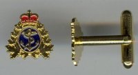 Gold cufflinks with the navy crest in colour.