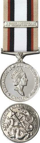 Front and back face of the silver South West Asia Service Medal, also shown is the tan, red, black and white ribbon and the silver Afghanistan bar
