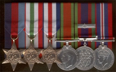 Rack of courmounter second world war medals.